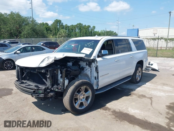 2020 Chevrolet Suburban Premier with VIN 1GNSCJKC9LR125292, listed as a IAAI auction lot 42073858 with 92,363 mi miles and . Bid and sale history available at DreamBid. Image 2.