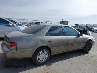 2001 Toyota Camry CE z VIN 4T1BG22K31U069513, wystawiony jako IAAI lot #42243673 z przebiegiem 137 241 mil mil oraz . Historia ofert i sprzedaży dostępna na DreamBid. Obrazek 13.