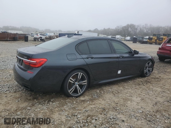 2019 BMW 7 Series 750i with VIN WBA7F0C54KGM25281, listed as a Copart auction lot 84741334 with 76,472 mi miles and Salvage Title. Bid and sale history available at carsss.com. Image 3.