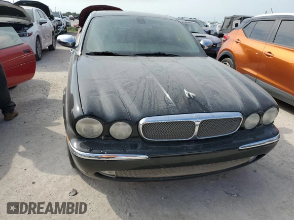 2006 Jaguar XJ with VIN SAJWA71BX6SH01193, listed as a Copart auction lot 76382034 with 0 mi miles and Salvage Title. Bid and sale history available at carsss.com. Image 5.