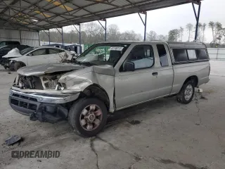 1999 Nissan Frontier XE with VIN 1N6DD26SXXC344449, listed as a Copart auction lot 43748015 with 137,318 mi miles and Salvage title. Bid and sale history available at DreamBid. Image 1.