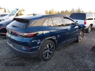 2023 Volkswagen ID.4 Pro z VIN 1V2DNPE81PC017620, wystawiony jako IAAI lot #41573053 z przebiegiem 15 462 mil mil oraz . Historia ofert i sprzedaży dostępna na DreamBid. Obrazek 4.