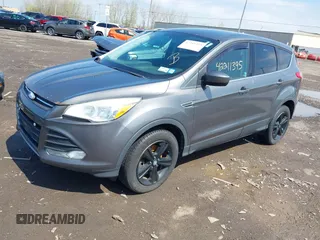 2013 Ford Escape SE with VIN 1FMCU9GX0DUA52263, listed as a IAAI auction lot 42211395 with 140,067 mi miles and . Bid and sale history available at DreamBid. Image 2.