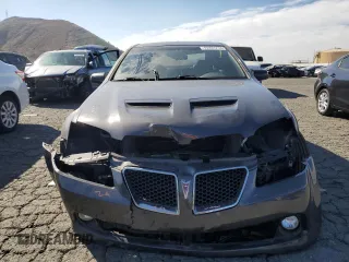 2009 Pontiac G8 GT with VIN 6G2EC57Y19L215718, listed as a Copart auction lot 77231714 with 57,515 mi miles and Salvage Title. Bid and sale history available at carsss.com. Image 5.