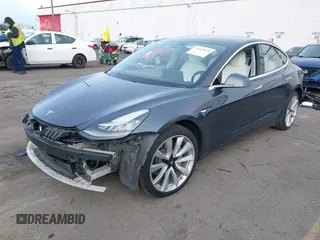 2018 Tesla Model 3 Long Range Battery with VIN 5YJ3E1EB9JF097118, listed as a IAAI auction lot 41619510 with 64,132 mi miles and . Bid and sale history available at DreamBid. Image 21.