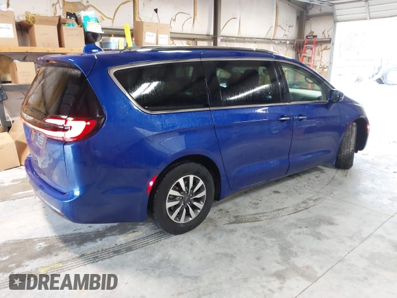2021 Chrysler Pacifica Touring L z VIN 2C4RC1BGXMR503108, wystawiony jako IAAI lot #41914136 z przebiegiem 98 685 mil mil oraz . Historia ofert i sprzedaży dostępna na DreamBid. Obrazek 4.