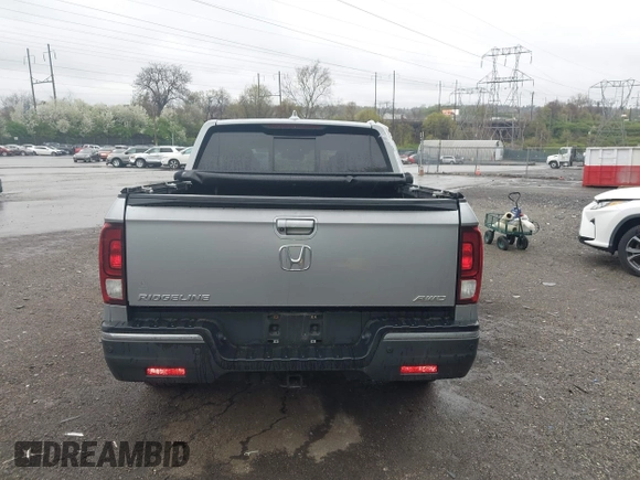 2020 Honda Ridgeline RTL-E with VIN 5FPYK3F73LB004365, listed as a IAAI auction lot 41965887 with 80,981 mi miles and . Bid and sale history available at DreamBid. Image 16.