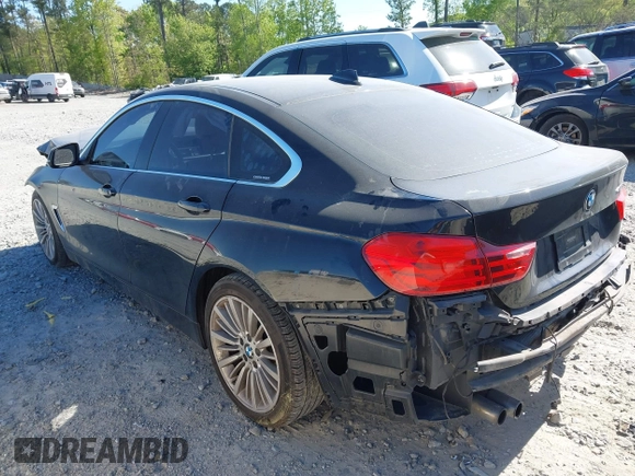 2015 BMW 4 Series 428i with VIN WBA4A5C51FG051393, listed as a IAAI auction lot 42041960 with 136,929 mi miles and . Bid and sale history available at carsss.com. Image 3.