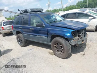 2001 Jeep Grand Cherokee Laredo with VIN 1J4GW48N61C543402, listed as a IAAI auction lot 42601612 with 160,934 mi miles and . Bid and sale history available at DreamBid. Image 1.