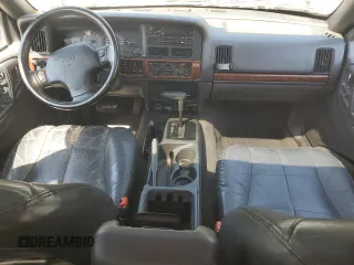 1998 Jeep Grand Cherokee Limited with VIN 1J4GZ78YXWC160346, listed as a Copart auction lot 52595655 with Not provided miles and Salvage title. Bid and sale history available at DreamBid. Image 8.