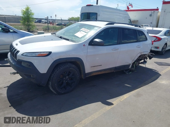 2018 Jeep Cherokee Trailhawk with VIN 1C4PJMBX3JD548761, listed as a IAAI auction lot 42107376 with 148,525 mi miles and . Bid and sale history available at DreamBid. Image 16.
