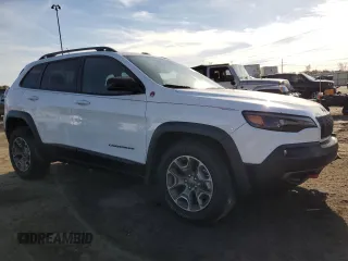 2022 Jeep Cherokee Trailhawk with VIN 1C4PJMBX3ND505107, listed as a Copart auction lot 77418384 with 12,952 mi miles and Clean Title. Bid and sale history available at carsss.com. Image 4.