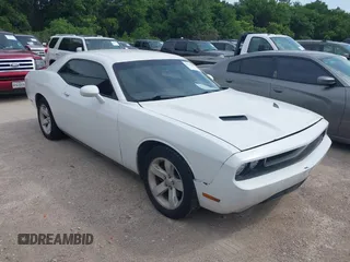 2014 Dodge Challenger SXT 100th Anniversary z VIN 2C3CDYAG5EH222827, wystawiony jako IAAI lot #42170404 z przebiegiem 201 260 mil mil oraz . Historia ofert i sprzedaży dostępna na DreamBid. Obrazek 1.