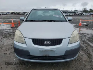 2009 Kia Rio LX with VIN KNADE223396443465, listed as a Copart auction lot 51370975 with 110,952 mi miles and Salvage Title. Bid and sale history available at carsss.com. Image 5.