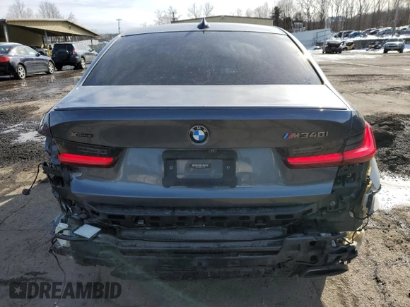 2020 BMW 3 Series M340i xDrive with VIN WBA5U9C02LFH17348, listed as a Copart auction lot 45452545 with 56,869 mi miles and Salvage Title. Bid and sale history available at DreamBid. Image 6.