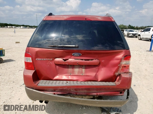 2005 Ford Freestyle SE with VIN 1FMZK01105GA54885, listed as a Copart auction lot 58414145 with 306,275 mi miles and Salvage title. Bid and sale history available at DreamBid. Image 6.