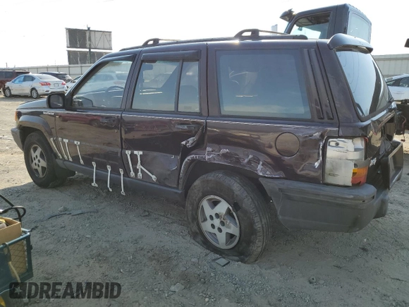 1993 Jeep Grand Cherokee Laredo with VIN 1J4GZ58S8PC656490, listed as a Copart auction lot 49377485 with 236,215 mi miles and Salvage Title. Bid and sale history available at carsss.com. Image 2.