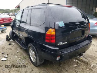 2004 GMC Envoy SLT with VIN 1GKDT13S942279670, listed as a Copart auction lot 73527974 with 120,425 mi miles and Salvage Title. Bid and sale history available at DreamBid. Image 2.