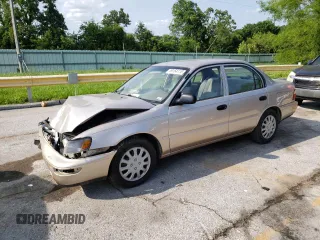 1997 Toyota Corolla with VIN 1NXBA02E0VZ564323, listed as a Copart auction lot 59164115 with 120,406 mi miles and Salvage title. Bid and sale history available at DreamBid. Image 1.