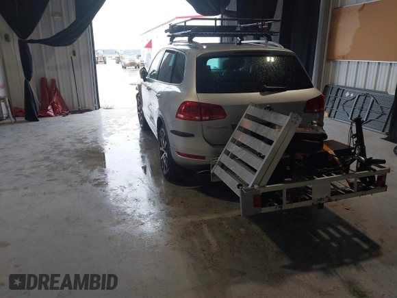 2011 Volkswagen Touareg Exec with VIN WVGFK9BP4BD005986, listed as a IAAI auction lot 41183877 with 109,005 mi miles and . Bid and sale history available at DreamBid. Image 3.