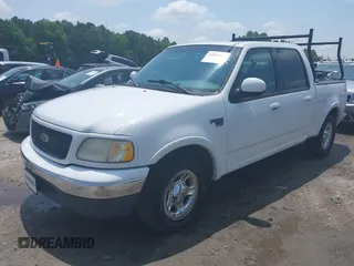 2001 Ford F-150 XLT with VIN 1FTRW07L91KB77612, listed as a IAAI auction lot 42432387 with 106,574 mi miles and . Bid and sale history available at DreamBid. Image 2.