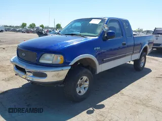 1997 Ford F-150 XL with VIN 1FTDX18W4VKC95711, listed as a IAAI auction lot 42197302 with 287,660 mi miles and . Bid and sale history available at DreamBid. Image 2.