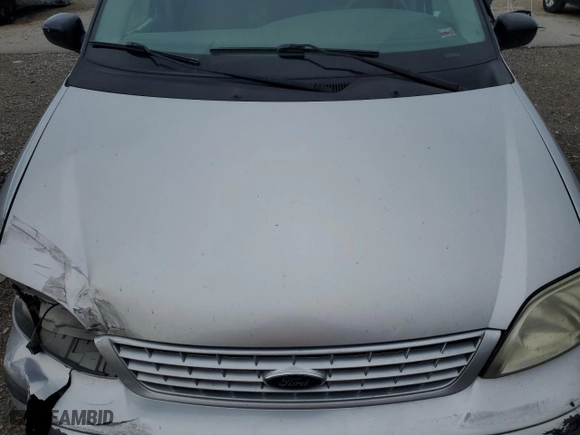 2003 Ford Windstar Wagon LX with VIN 2FMZA51433BA70321, listed as a Copart auction lot 77114094 with 125,267 mi miles and Salvage Title. Bid and sale history available at carsss.com. Image 12.