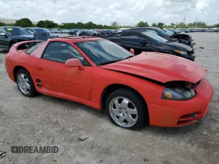 1999 Mitsubishi 3000GT GT z VIN JA3AM84J4XY001608, wystawiony jako Copart lot #64366944 z przebiegiem 153 804 mil mil oraz Tytuł czysty. Historia ofert i sprzedaży dostępna na DreamBid. Obrazek 4.