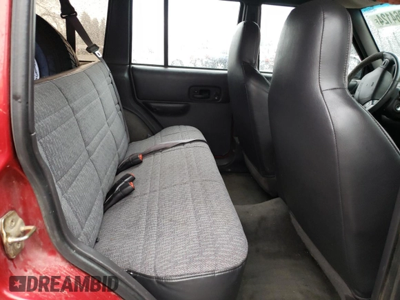 1999 Jeep Cherokee SE with VIN 1J4FF28S9XL645291, listed as a Copart auction lot 87064124 with Not provided miles and Salvage title. Bid and sale history available at DreamBid. Image 11.