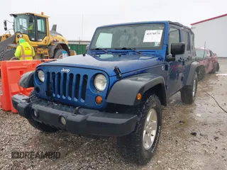 2009 Jeep Wrangler Unlimited X with VIN 1J4GA39189L787777, listed as a IAAI auction lot 41570579 with 193,163 mi miles. Bid and sale history available at carsss.com. Image 2.