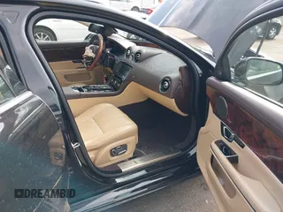 2015 Jaguar XJ with VIN SAJWA1CZ9F8V78228, listed as a IAAI auction lot 41260138 with 52,622 mi miles. Bid and sale history available at carsss.com. Image 5.