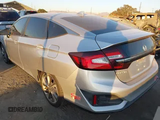 2018 Honda Clarity with VIN JHMZC5F15JC018312, listed as a IAAI auction lot 41354648 with 97,035 mi miles and . Bid and sale history available at DreamBid. Image 3.