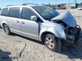 2009 Dodge Grand Caravan SXT with VIN 2D8HN54X79R602455, listed as a IAAI auction lot 41037230 with 202,385 mi miles. Bid and sale history available at carsss.com. Image 1.