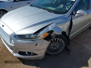 2014 Ford Fusion Titanium Hybrid with VIN 3FA6P0RUXER103516, listed as a IAAI auction lot 42004602 with 128,287 mi miles and . Bid and sale history available at carsss.com. Image 6.