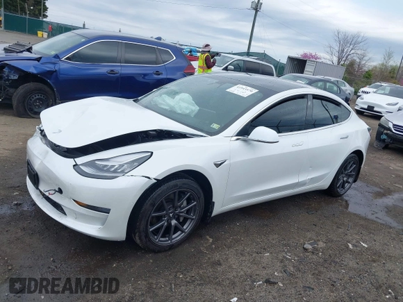 2019 Tesla Model 3 Mid Range with VIN 5YJ3E1EA5KF397098, listed as a IAAI auction lot 41943570 with 72,046 mi miles and . Bid and sale history available at DreamBid. Image 14.