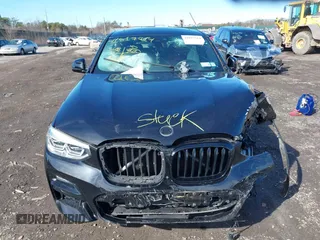 2021 BMW X4 M40i with VIN 5UX2V5C03M9H54824, listed as a IAAI auction lot 41817714 with 34,880 mi miles. Bid and sale history available at carsss.com. Image 12.