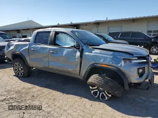 2024 GMC Canyon 4WD AT4 with VIN 1GTP6DEK8R1264699, listed as a Copart auction lot 76604464 with 2,406 mi miles and Salvage Title. Bid and sale history available at carsss.com. Image 4.