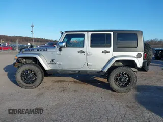 2010 Jeep Wrangler Unlimited Sahara with VIN 1J4BA5H14AL230604, listed as a IAAI auction lot 41884346 with 97,060 mi miles. Bid and sale history available at carsss.com. Image 14.