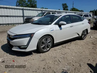 2018 Honda Clarity Touring z VIN JHMZC5F3XJC007761, wystawiony jako Copart lot #65734965 z przebiegiem 175 535 mil mil oraz Czysty tytuł • Clean title. Historia ofert i sprzedaży dostępna na DreamBid. Obrazek 1.