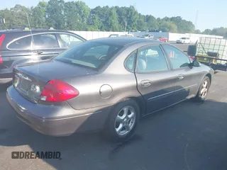 2002 Ford Taurus SES Standard z VIN 1FAFP55U22A172533, wystawiony jako IAAI lot #42680611 z przebiegiem 122 306 mil mil oraz . Historia ofert i sprzedaży dostępna na DreamBid. Obrazek 4.