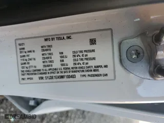 2021 Tesla Model 3 Standard Range Plus with VIN 5YJ3E1EA9MF100403, listed as a Copart auction lot 48561545 with 68,996 mi miles and Salvage Title. Bid and sale history available at carsss.com. Image 12.
