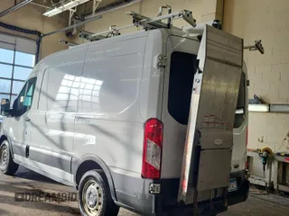 2018 Ford Transit with VIN 1FTBW9CG0JKB22853, listed as a IAAI auction lot 42122261 with 133,489 mi miles. Bid and sale history available at carsss.com. Image 1.