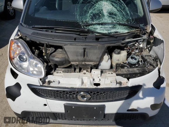 2013 Smart fortwo Pure z VIN WMEEJ3BA5DK694853, wystawiony jako Copart lot #74003734 z przebiegiem 27 720 mil mil oraz Szkoda całkowita • Salvage title. Historia ofert i sprzedaży dostępna na DreamBid. Obrazek 11.