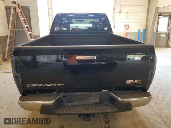 2010 GMC Canyon SLE1 with VIN 1GTJTCDE0A8101092, listed as a Copart auction lot 52311654 with 133,742 mi miles and Salvage title. Bid and sale history available at DreamBid. Image 6.