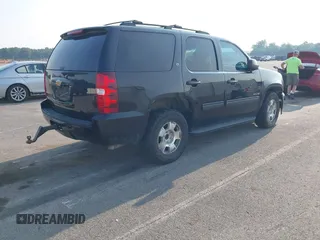 2014 Chevrolet Tahoe LT with VIN 1GNSCBE01ER235571, listed as a IAAI auction lot 42403118 with 238,069 mi miles and . Bid and sale history available at DreamBid. Image 4.