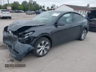 2024 Tesla Model Y with VIN 7SAYGDED3RF002246, listed as a IAAI auction lot 41566184 with 10,316 mi miles and . Bid and sale history available at DreamBid. Image 2.