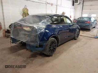2021 Tesla Model Y Long Range with VIN 5YJYGDEE2MF185945, listed as a IAAI auction lot 41599029 with 53,815 mi miles and . Bid and sale history available at DreamBid. Image 4.