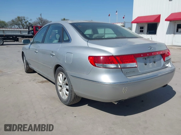 2006 Hyundai Azera SE with VIN KMHFC46FX6A107141, listed as a IAAI auction lot 41793111 with 124,137 mi miles and . Bid and sale history available at DreamBid. Image 3.