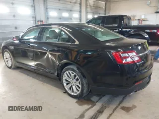 2015 Ford Taurus Limited with VIN 1FAHP2J87FG172580, listed as a IAAI auction lot 41891567 with 183,784 mi miles. Bid and sale history available at carsss.com. Image 3.