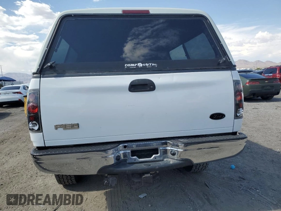 2002 Ford F-150 XL z VIN 1FTRX18L42NB40419, wystawiony jako Copart lot #60486205 z przebiegiem 241 853 mil mil oraz Szkoda całkowita • Salvage title. Historia ofert i sprzedaży dostępna na DreamBid. Obrazek 6.